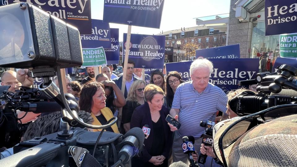 maura healey campaigning for governor surrounded by press