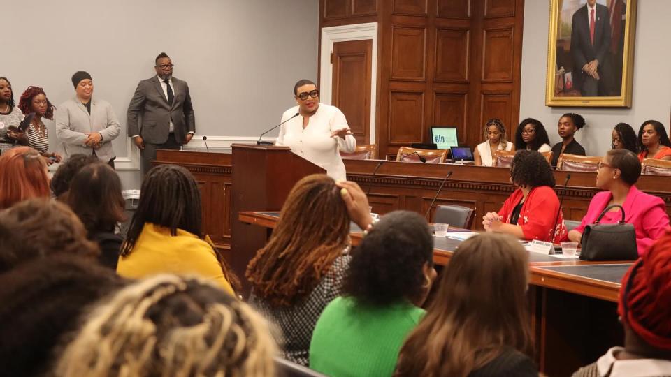 woman speaking to audience