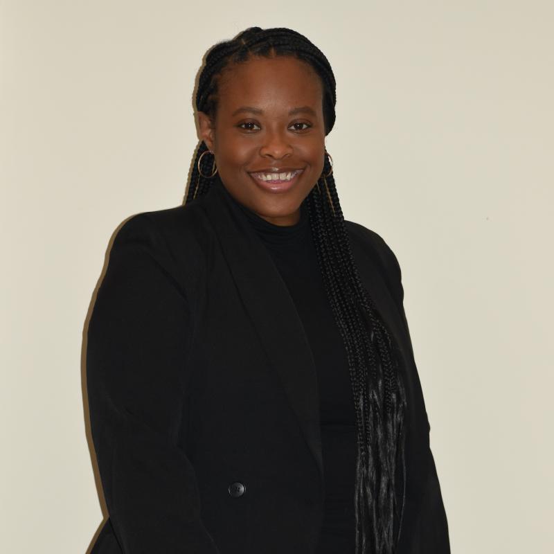 Headshot of Cindelle Harris-Blackmon in all black