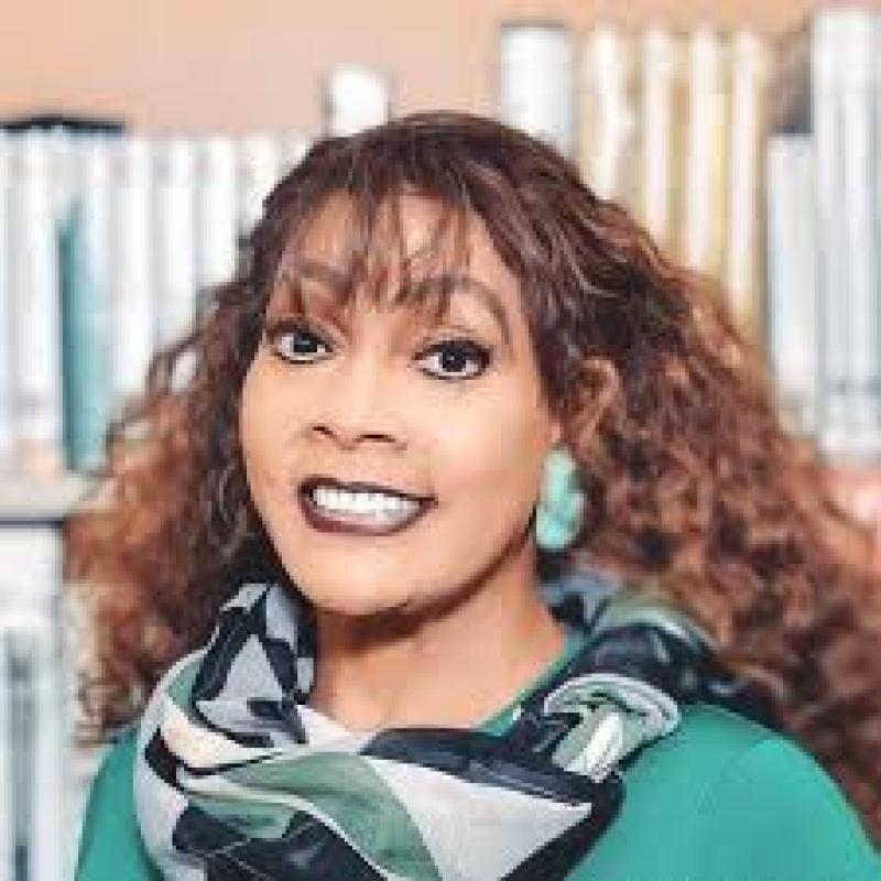 Dr. Rendee Baskerville in a library