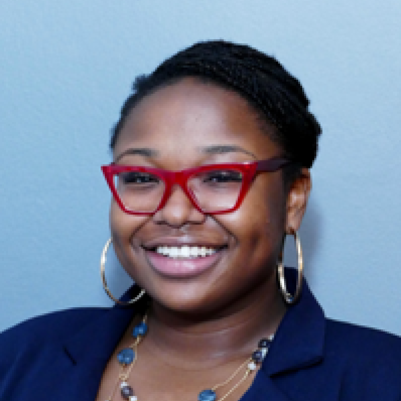 Essex County Commissioner A'Dorian Murray Thomas in a blue blazer against a lighter blue backdrop