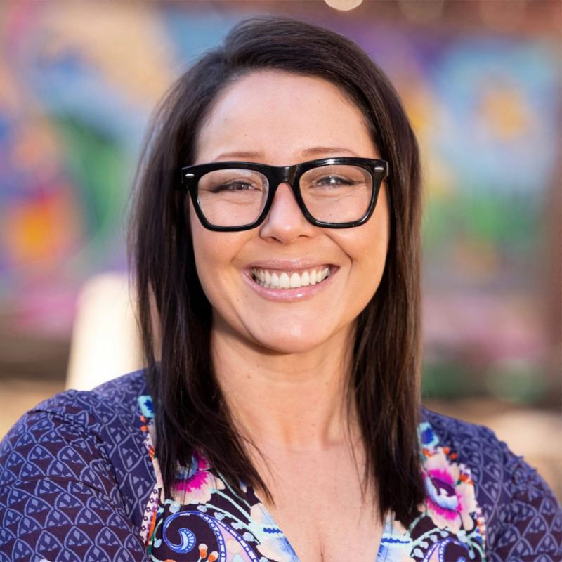 Mayor Sheena Collum against a colorful backdrop
