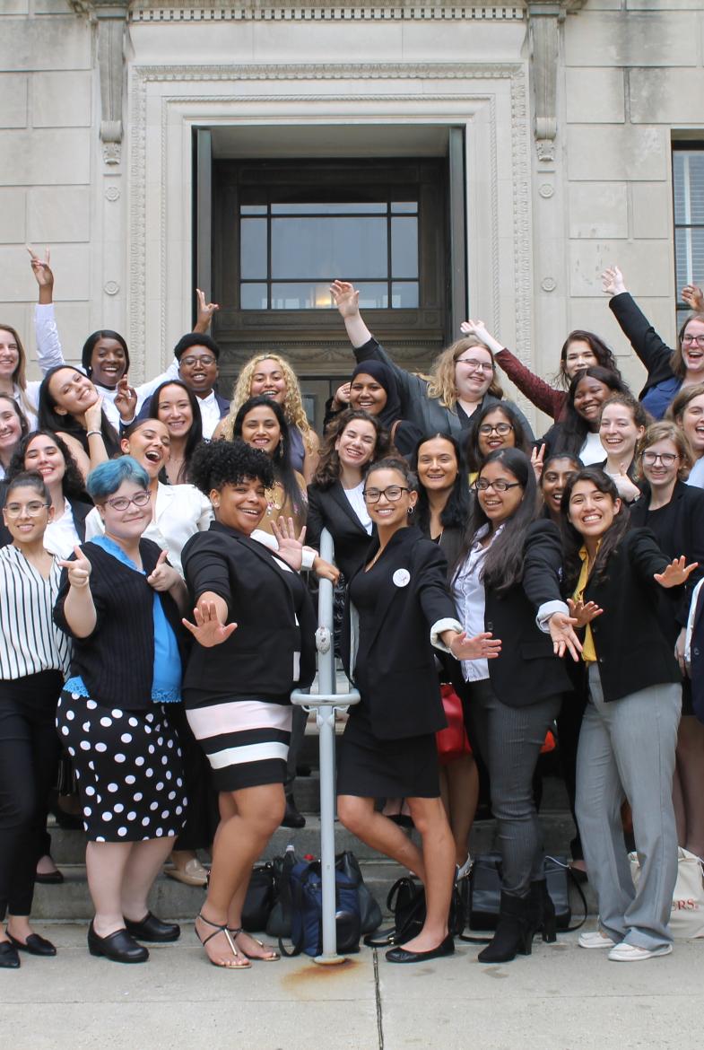 Group of young women posing on steps